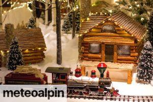 multicolored train toy near house